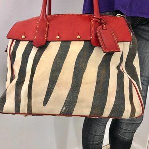 Dooney& Bourke Florentine Vachetta leather Giraffe Juliette duffle bag .